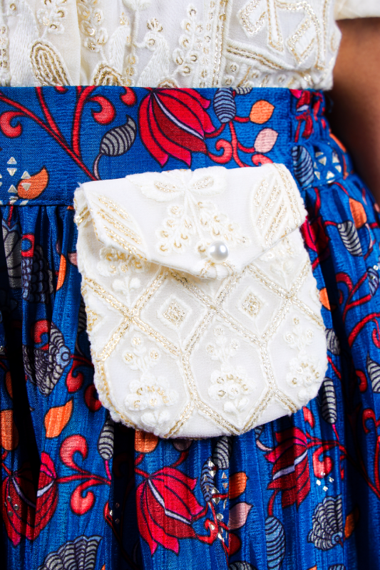 Ivory Embroidered crop top lotas print skirt with attached pouch
