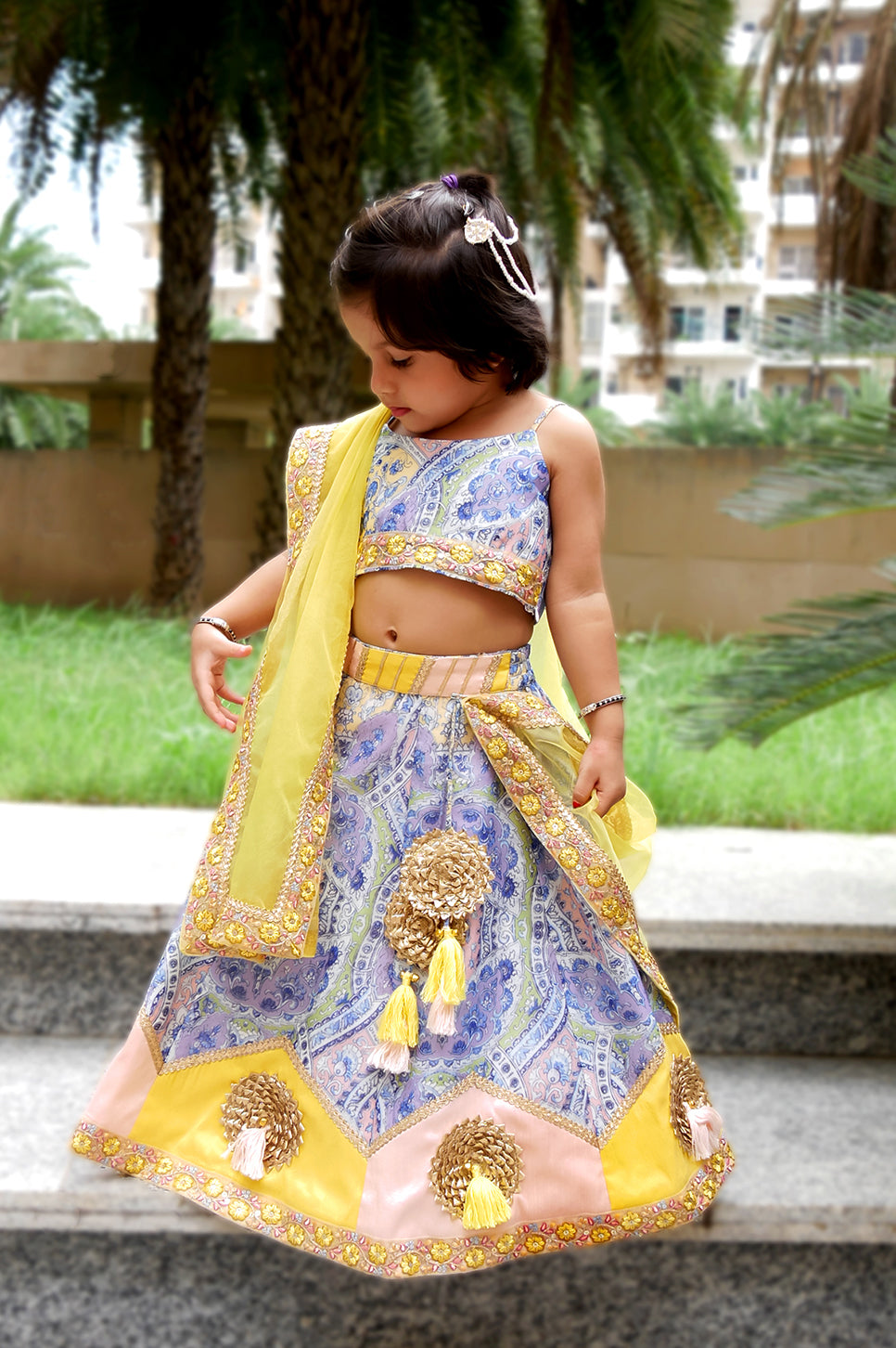 Colorful motif printed top and top and gota lace detailed lehenga with attached net dupatta