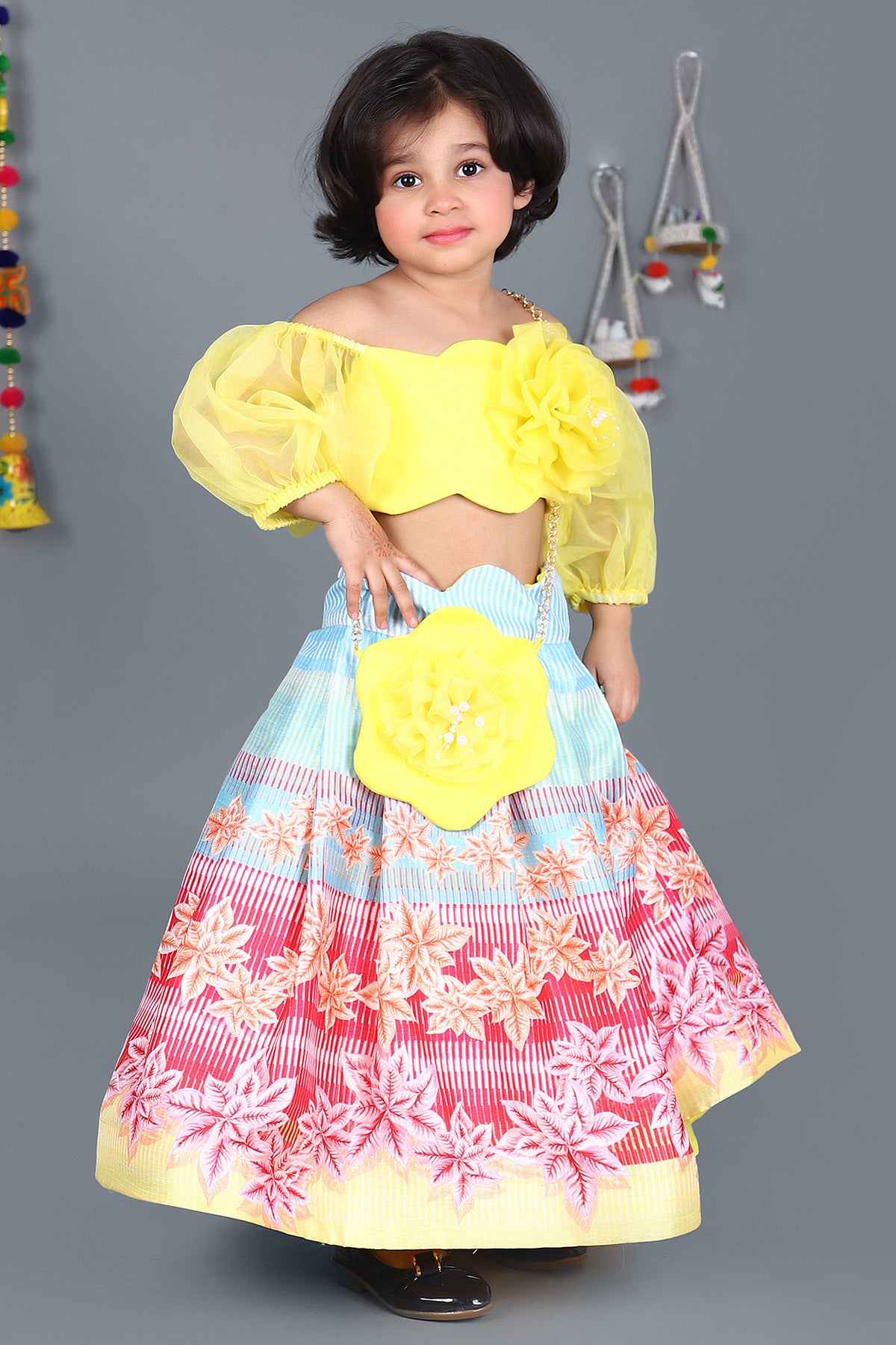 Yellow scalloped top and floral printed skirt with sling bag