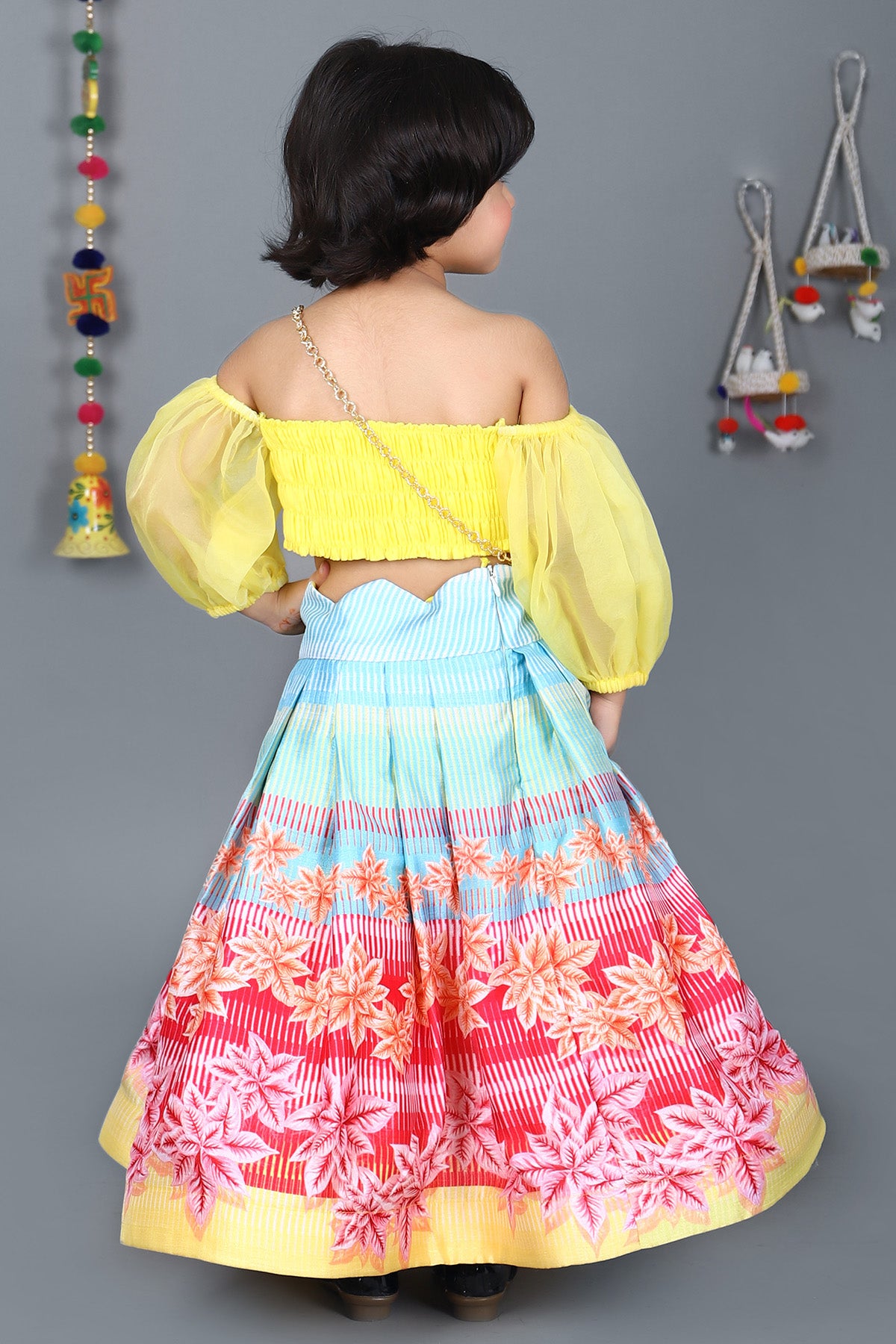 Yellow scalloped top and floral printed skirt with sling bag