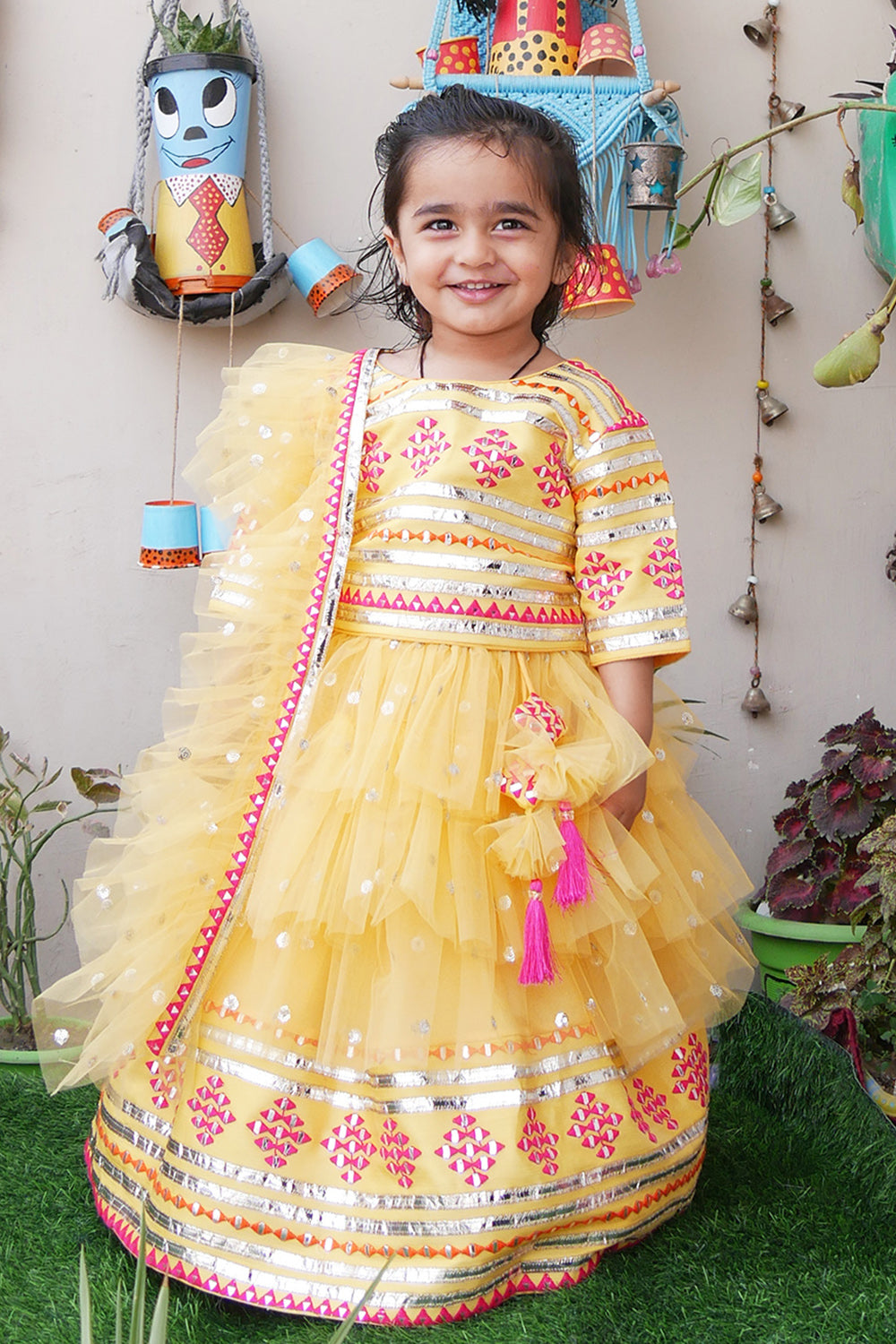 Yellow embroidered choli and lehenga with frilly dupatta